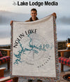 Throw blanket with Nolin Lake map design and compass rose graphic.