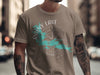 Taupe t-shirt with "Rainy Lake Minnesota" and compass graphic.