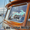 Turquoise map outline sticker and "James Life" text on boat window.