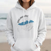 White hoodie with "Dream Lake Colorado" text and a compass rose graphic.