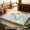 A glass cutting board featuring a blue map of Lake Fork, Texas, on a wooden outdoor bar.