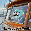 "Waco Life" sticker on a boat window with "Lake Lodge Media" text.