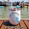 A white insulated wine tumbler with Lake Livingston Texas graphics sits on a boat deck.