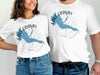 Two people wear white t-shirts with Lake Granby Colorado map and compass design.