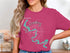 Pink t-shirt with "Beautiful Lake Granbury Texas" and compass graphic.