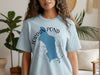 Light blue t-shirt with a blue Jordan Pond map outline and compass design.