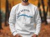 White sweatshirt with Lake Merwin Washington graphic and compass detail.