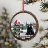 Bear, cardinal, and cabin in snowy woods ornament with customizable names and year.