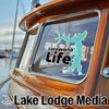 Lake Lodge Media logo and "Lotawana Life" sticker on a boat window.