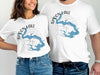 White t-shirts with Spoon Lake, Illinois map and compass design.