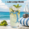 Glass of iced drink with lime and mint, featuring Lake Lotawana outline and compass.