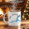White mug with Lake Jackson, Georgia map and compass design, steaming coffee splashing.