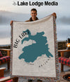 Woven blanket featuring a teal map outline of Big Lake, Arizona.