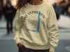 Cream sweatshirt with Lake Vermilion Minnesota compass graphic and copyrighted text.
