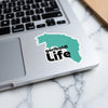 "Garibaldi Life" sticker on a laptop keyboard surrounded by a marble pattern.