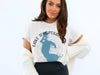 White t-shirt with a blue Lake Tohopekaliga map design and compass rose graphic.