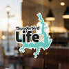 Thunderbird Life sticker featuring a turquoise lake outline and text on a window.