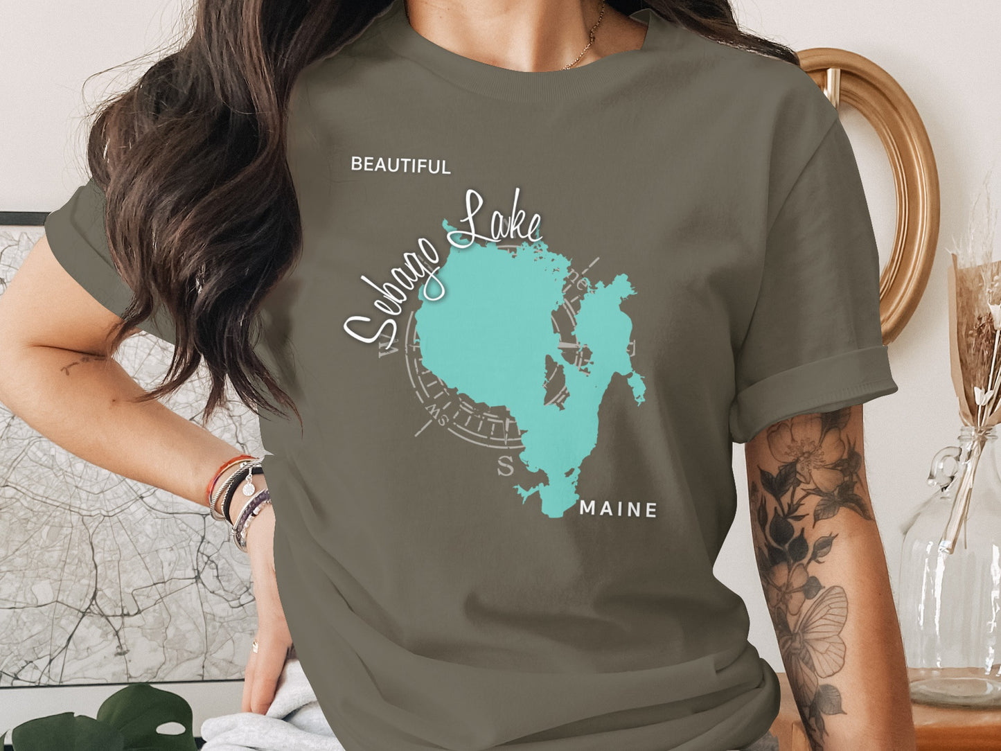 Sebago Lake Maine map with compass rose on a dark green t-shirt.