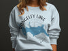 Light blue sweatshirt with Rangeley Lake Maine map and compass graphic.