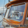 Sticker on a wooden boat window reads "Francis Case Life."