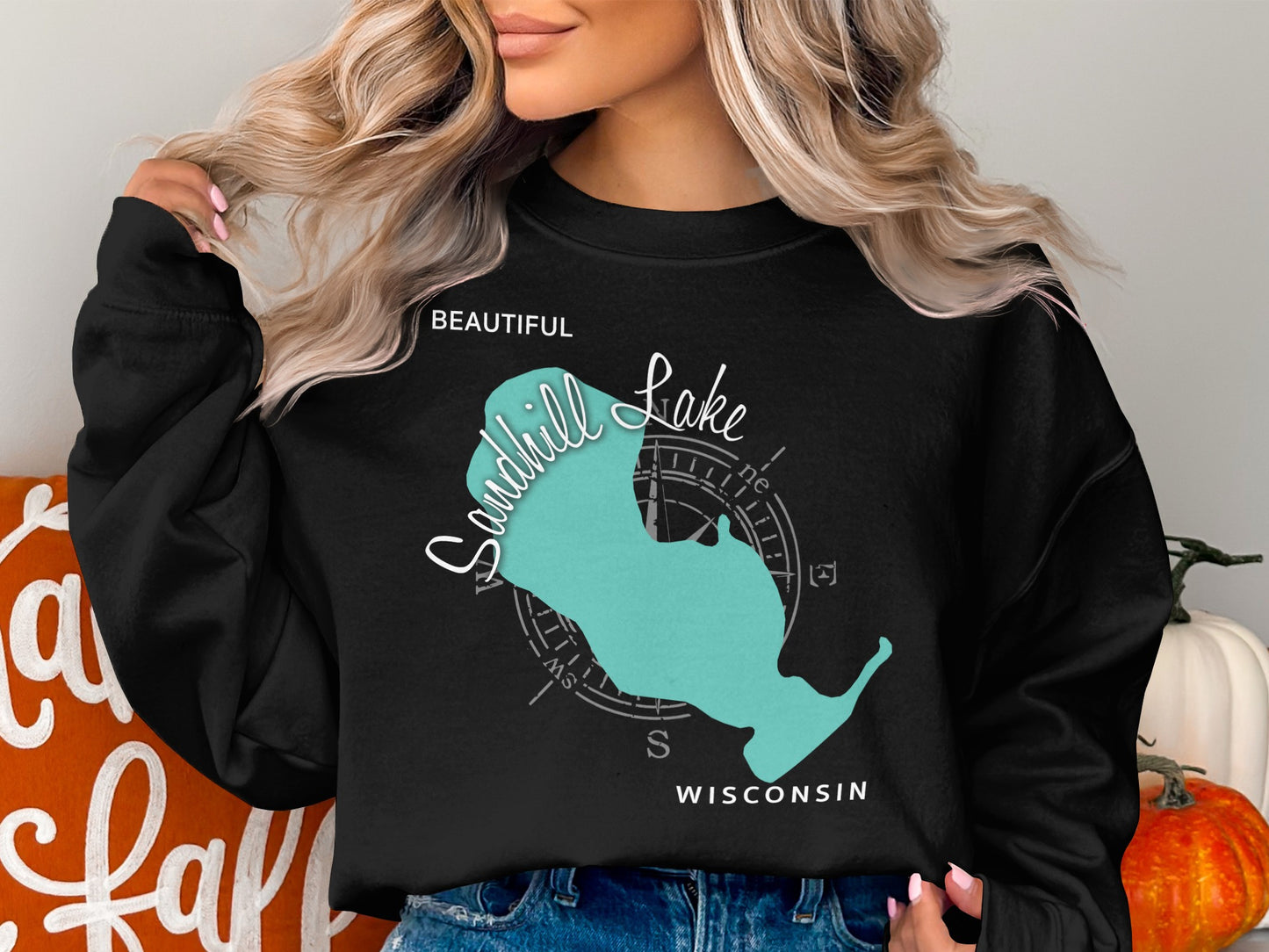 Black sweatshirt with blue Sandhill Lake, Wisconsin graphic and compass.
