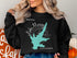 Black sweatshirt with "Lake Murray California" and compass rose graphic.