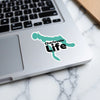 Turquoise Charlevoix Life sticker with black text on a laptop.