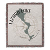 Woven blanket with a map of Lizard Lake, Minnesota, and a compass rose.