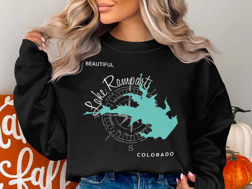 Black sweatshirt with turquoise Lake Rampart map and compass graphic.