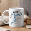 White mug with Lake Shelbyville map and compass design, "ILLINOIS" text.