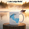 White mug with "Sylvan Lake South Dakota" map and compass design on lake background.