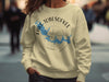Crewneck sweatshirt with Lake Tobesofkee, Georgia graphic and compass design.