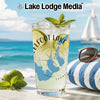 Glass with "Elfoot Lake" and Tennessee map design on a beach with sailboat.