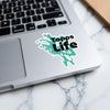 Sticker with teal abstract design and "Tapps Life" text on a laptop.