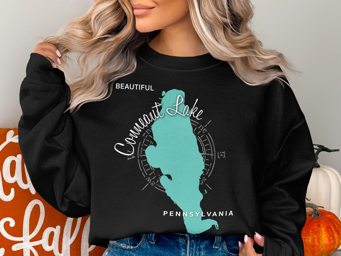 Black sweatshirt with a teal compass and "Beautiful Conneaut Lake Pennsylvania" graphic.