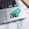 Teal sticker with "Perris Life" text on a laptop keyboard.