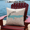 Decorative pillow with Enid Lake map and compass on a wooden chair by water.