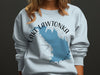 Light blue sweatshirt with blue map of Lake Lawtonka, Oklahoma and compass rose graphic.