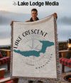 Woven blanket with Lake Crescent, Washington map and compass design.