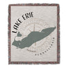 Lake Erie map on woven throw blanket with compass and text.