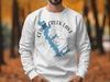 White sweatshirt with a blue map of Cedar Creek Lake, Texas, and compass rose.