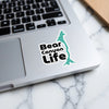 Bear Canyon Life sticker with teal outline on laptop keyboard