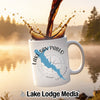 White mug with Lake San Pablo design and coffee splash against a foggy lake.