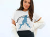 White t-shirt with "Lakewood Lakes Missouri" and lake shape graphic.