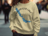Cream sweatshirt with Chautauqua Lake map and compass graphic and "New York" text.