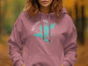 Pink hoodie with white and teal "Squam Lake New Hampshire" map and compass graphic.