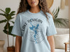 Light blue t-shirt with graphic of Lake Michigan shape and compass, "Lake Michigan Wisconsin" text.