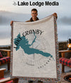 Tapestry blanket with teal Granby, Colorado lake outline and compass design.