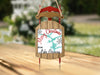 Wooden sled ornament with "Merry Christmas From Lake Gre...".