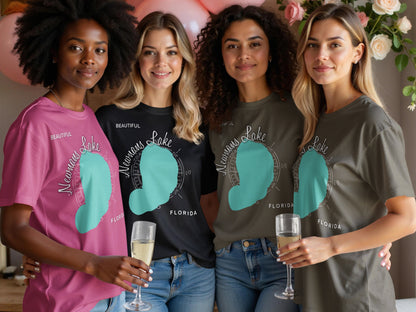 Four women wear t-shirts with a Newnans Lake Florida graphic.